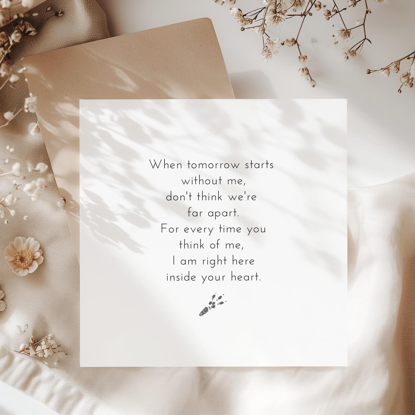 Guinea pig pet loss card featuring a heartfelt poem and tiny paw prints, surrounded by soft dried flowers and neutral textures.