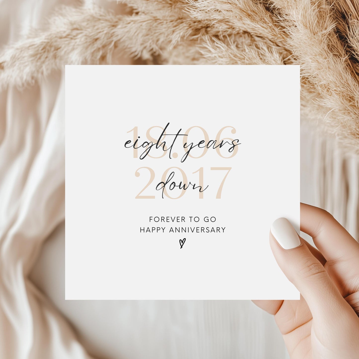 Personalised eight-year anniversary card featuring soft beige date, script text reading “Eight Years Down”, and a small heart detail.