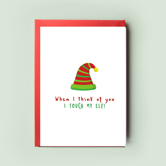 Humorously depicted &#39;When I think of you, I touch my elf&#39; Christmas Card, combining festive cheer with a playful adult twist, perfect for those looking for a hearty festive laugh.