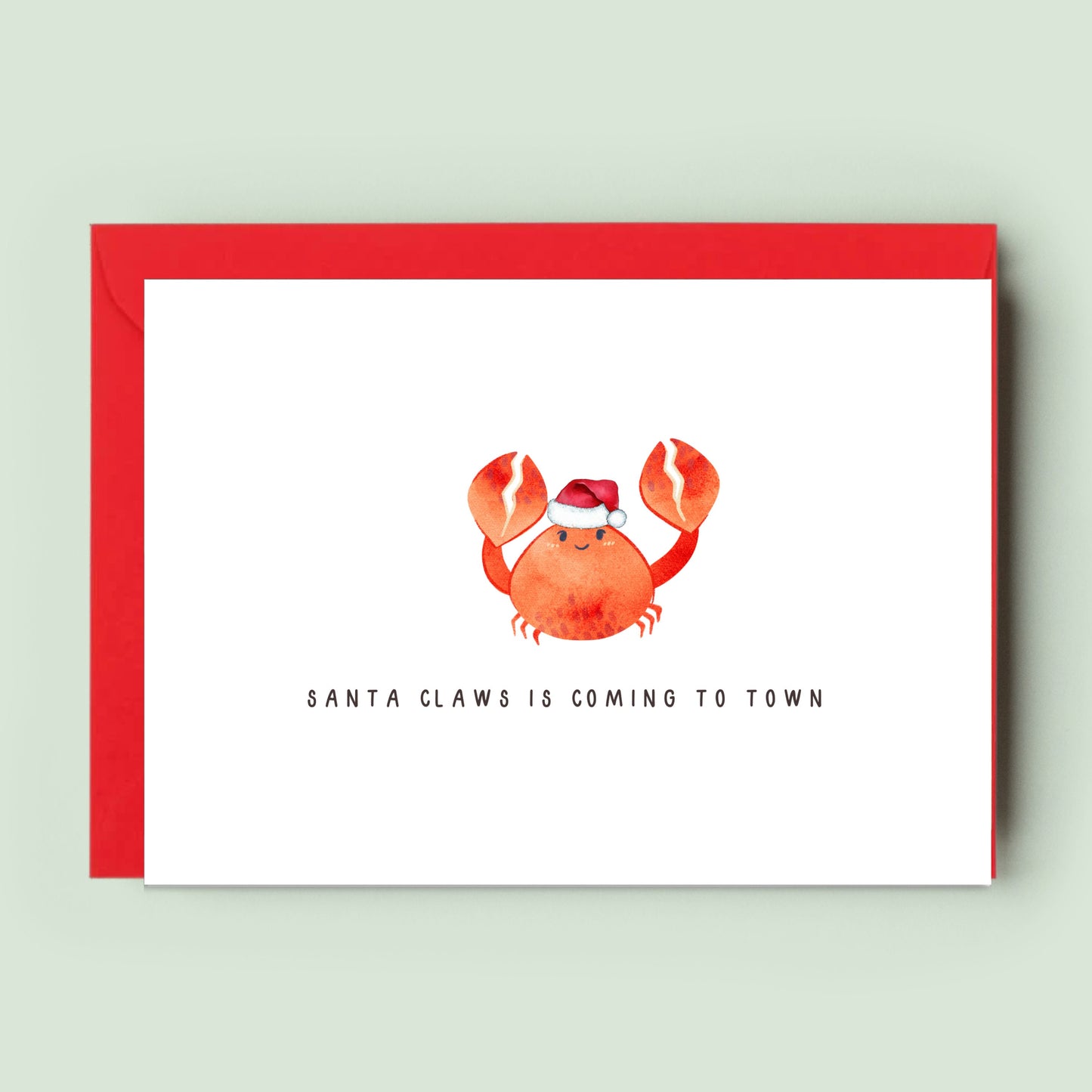 Whimsical &#39;SANTA CLAWS IS COMING TO TOWN&#39; Christmas Card featuring a festive crab in a Santa hat, perfect for spreading unique and playful holiday cheer to all.