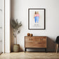 Framed personalised print of two women standing side by side, hanging on the wall above a wooden cabinet in a modern room. The print includes a quote about friendship. A potted plant and decor items sit next to the cabinet.