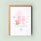 Personalised christening card featuring a large pink letter “H” with a teddy bear holding balloons. The text reads “To a special granddaughter on your christening day,” followed by the name “Holly” and date. Comes with a recycled kraft envelope.