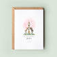 Personalised baptism card featuring an illustrated white church with a cross and soft pink hearts in the background. The text reads “On your Baptism,” followed by the name and date. Comes with a recycled kraft envelope.