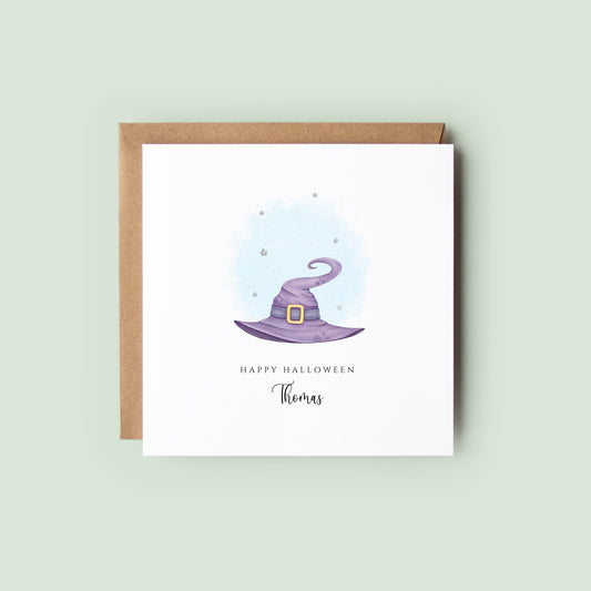 Personalised Halloween card featuring a purple witch hat with a starry background, “Happy Halloween” text, and the name Thomas beneath