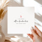 White card with “It all began with a drunken kiss one Tuesday night” design in black script with red hearts.