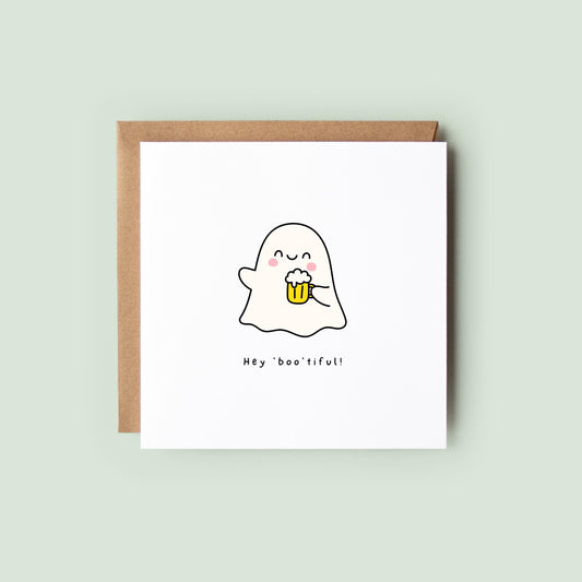 Cute Halloween card featuring a smiling ghost holding a beer with the words “Hey Boo’tiful!”