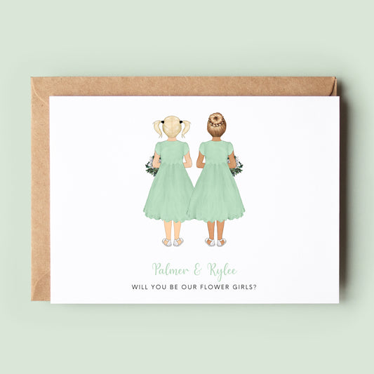 A personalised &#39;Will You Be My Flower Girl Twins&#39; card featuring customised dresses, skin tones, and hairstyles for the twin flower girls, along with custom text.